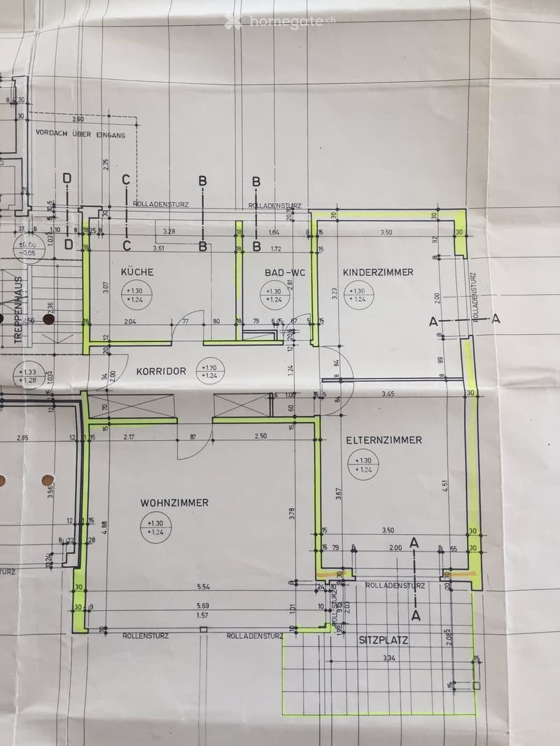 Floor plan showing a kitchen, bathroom, living room, children's room, parents' room, and a seating area. Includes labeled dimensions and rolladensturz (roller shutter) markings.