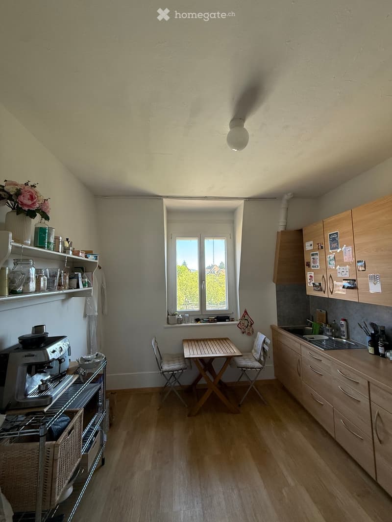 {"type": "Kitchen", "objects": ["refrigerator", "coffee maker", "sink", "cabinets", "table", "chair", "shelves", "vase", "flower", "cupboard", "oven", "faucet", "bottle", "cup", "oven", "cupboard", "cupboard", "cupboard", "cupboard", "cupboard", "cupboard