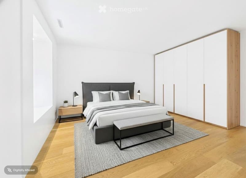Modern bedroom with a large bed, nightstands, lamps, a bench at the foot of the bed, a rug, and a tall wardrobe with wooden accents.
