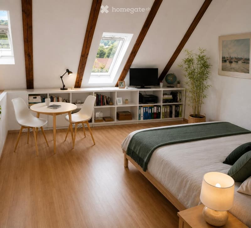 Bright, modern bedroom with wooden flooring, a large bed with green bedding, a nightstand with a lamp, a small round table with chairs, a bookshelf filled with books and decorative items, and a large window with a view.