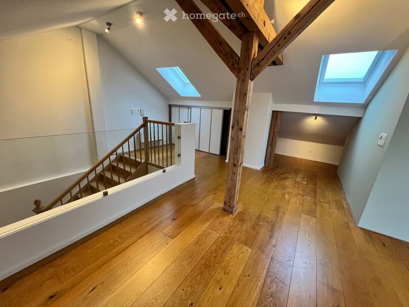 wooden stairs, wooden beams, wooden floor, white walls, glass railing