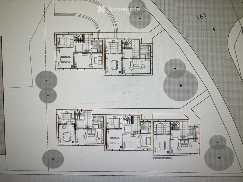 Floor plan showing multiple rooms including living areas, dining areas, bedrooms, and bathrooms. The layout includes labeled dimensions and room designations.