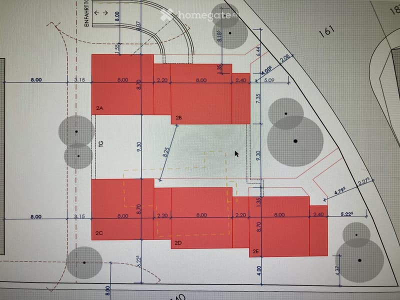 Floor plan showing multiple rooms labeled 2A, 2B, 2C, 2D, 2E, and TG, with dimensions and circular cutouts representing possible openings or fixtures.