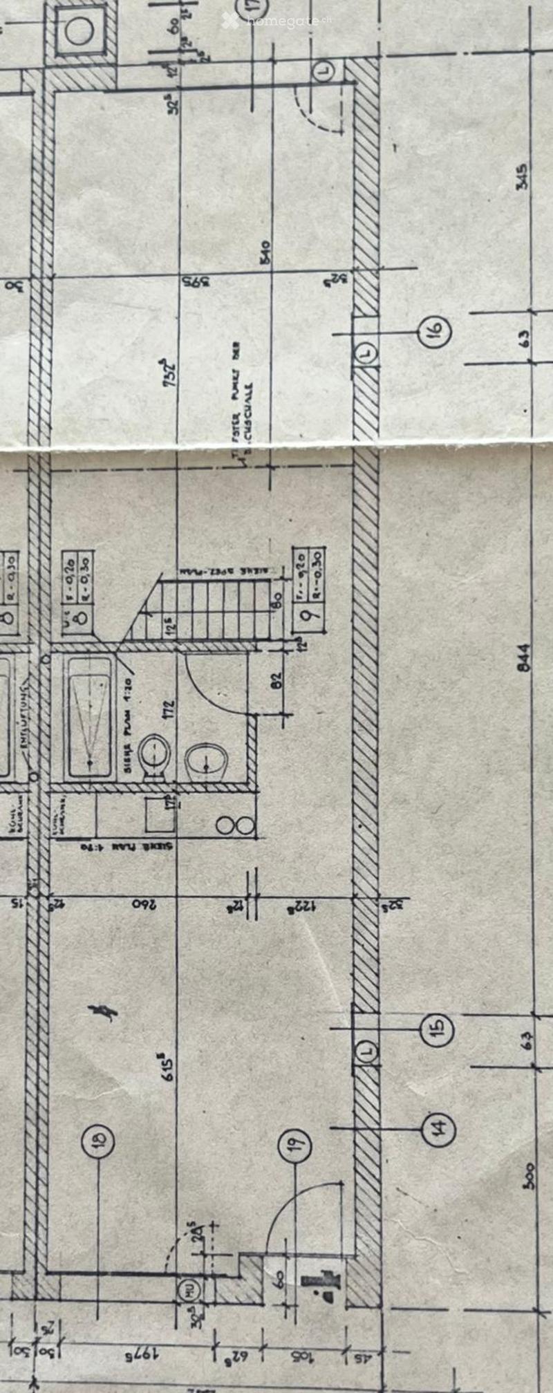 Floor plan showing multiple rooms and labeled dimensions, including a kitchen, living room, bedrooms, and bathrooms.
