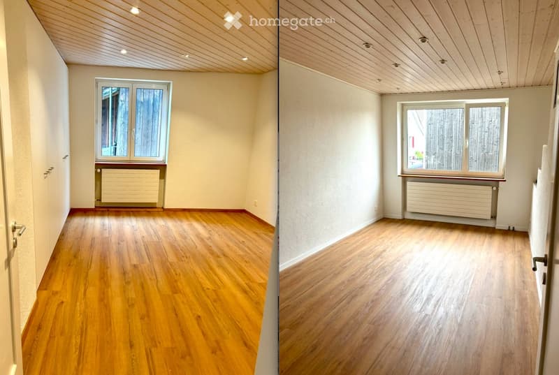 Empty room with wooden flooring, white walls, and a window with a radiator below it. The ceiling has recessed lighting.