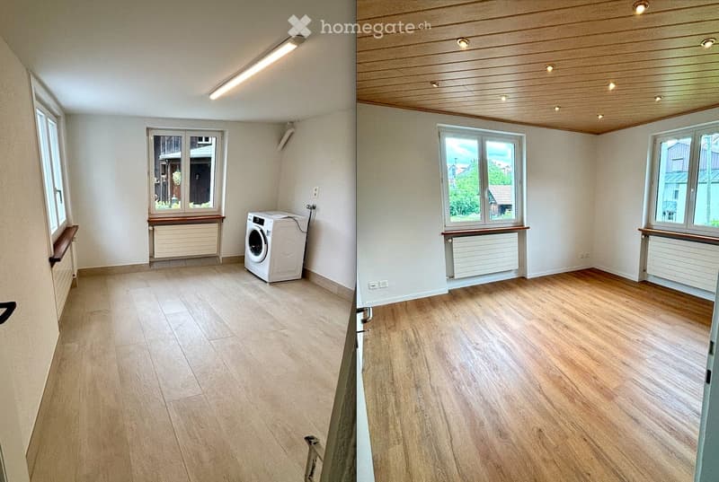 Two adjacent rooms with light-colored wooden flooring, white walls, and large windows. One room contains a white washing machine, while the other is completely empty.