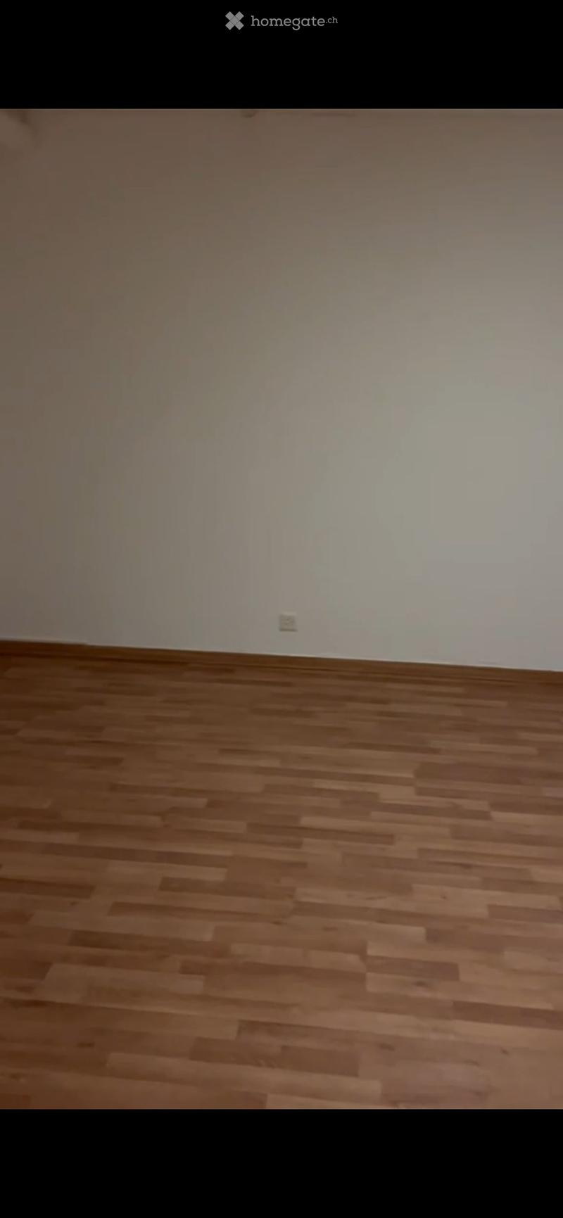 Empty room with wooden flooring and white walls, no furniture or equipment visible.
