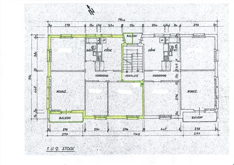 Floor plan of a two-story building showing living room, kitchen, bathrooms, bedrooms, and balconies.