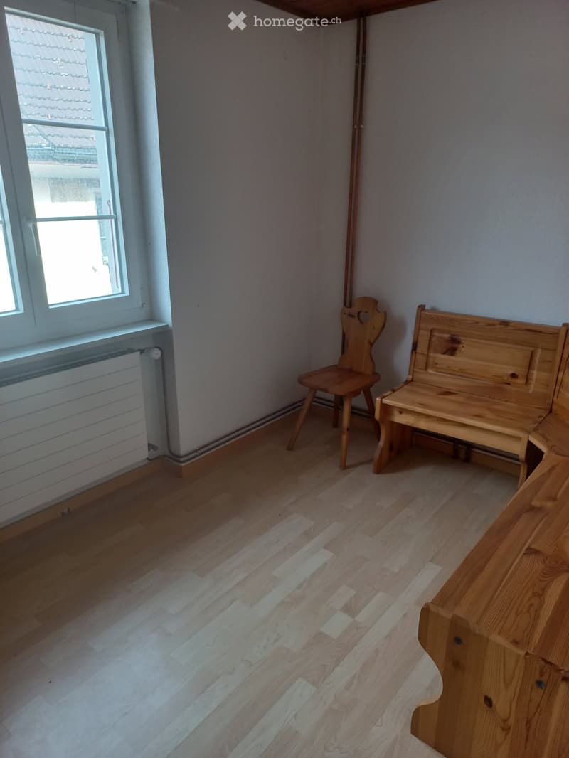wooden chair, wooden bench, radiator, wooden floor, large window