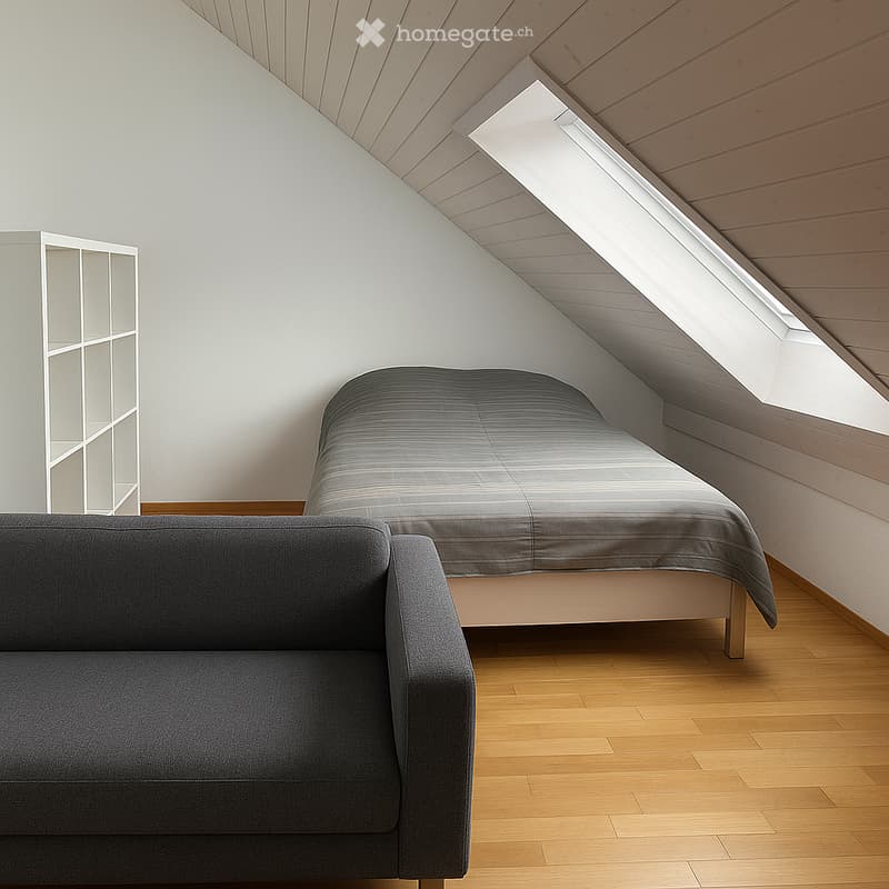 Modern attic bedroom with wooden slanted ceiling, skylight window, grey sofa, bed with grey duvet, and white shelving unit.