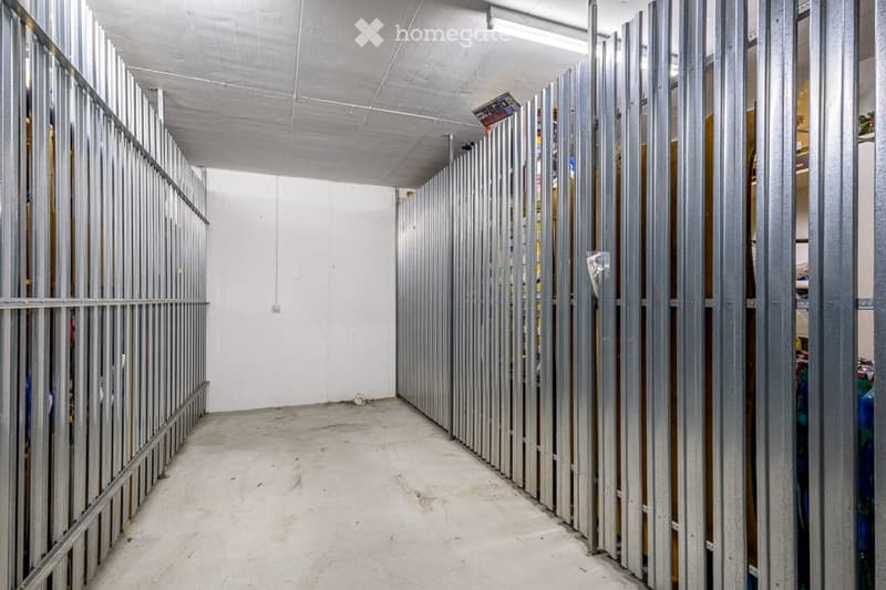 Empty room with exposed metal framing and concrete floor, no furniture or equipment.