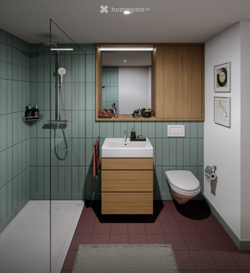 Modern bathroom with teal tiles, wooden vanity, white sink, toilet, shower, and a large mirror above the sink.