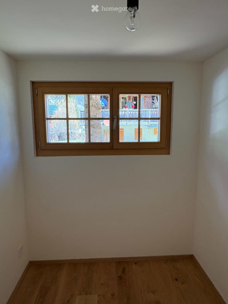 empty room, white walls, wooden floor, window with view