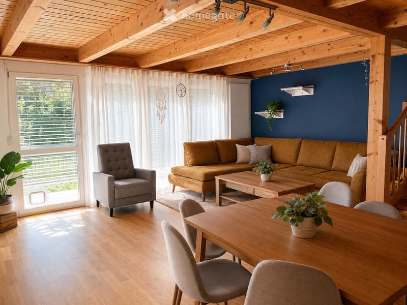 Open-concept living and dining area with exposed wooden beams, a grey armchair, a brown sectional sofa, a wooden coffee table, a dining table with chairs, and potted plants.