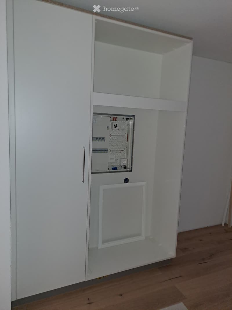 Closet, switchboard in the cabinet, white doors, power outlet