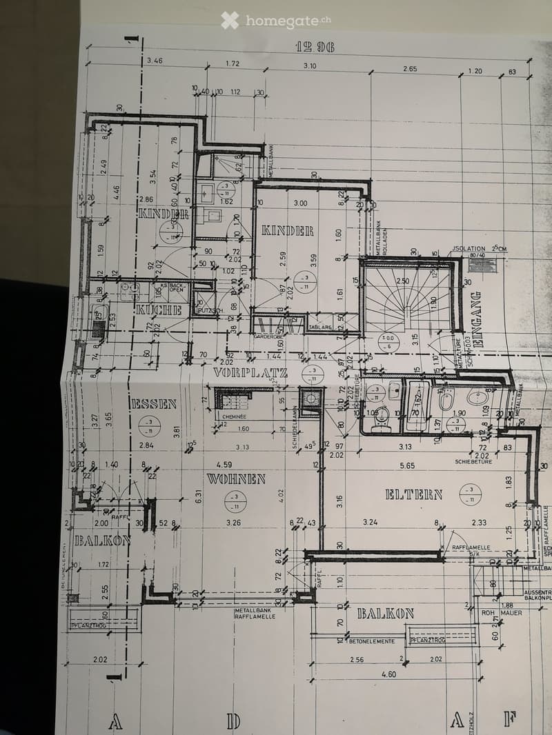 Floor plan of a residential building showing multiple rooms including kitchen, living room, bedrooms, and balconies.
