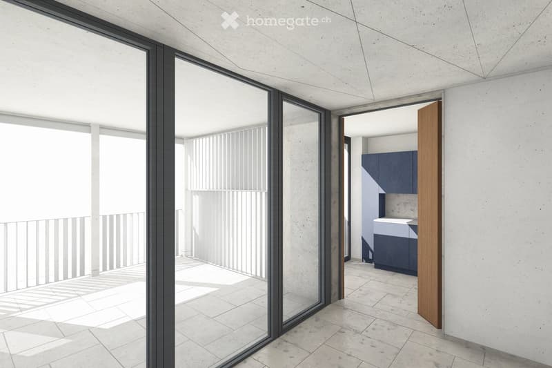 Modern interior with large glass sliding doors leading to a balcony, concrete walls, and a small kitchen area with dark cabinets.
