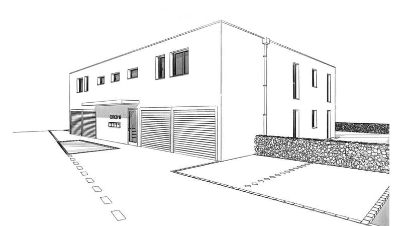 Modern single-story building with a flat roof, large garage doors, and multiple windows. The entrance features a small covered area with a sign, and the building is surrounded by a stone border and paved area.