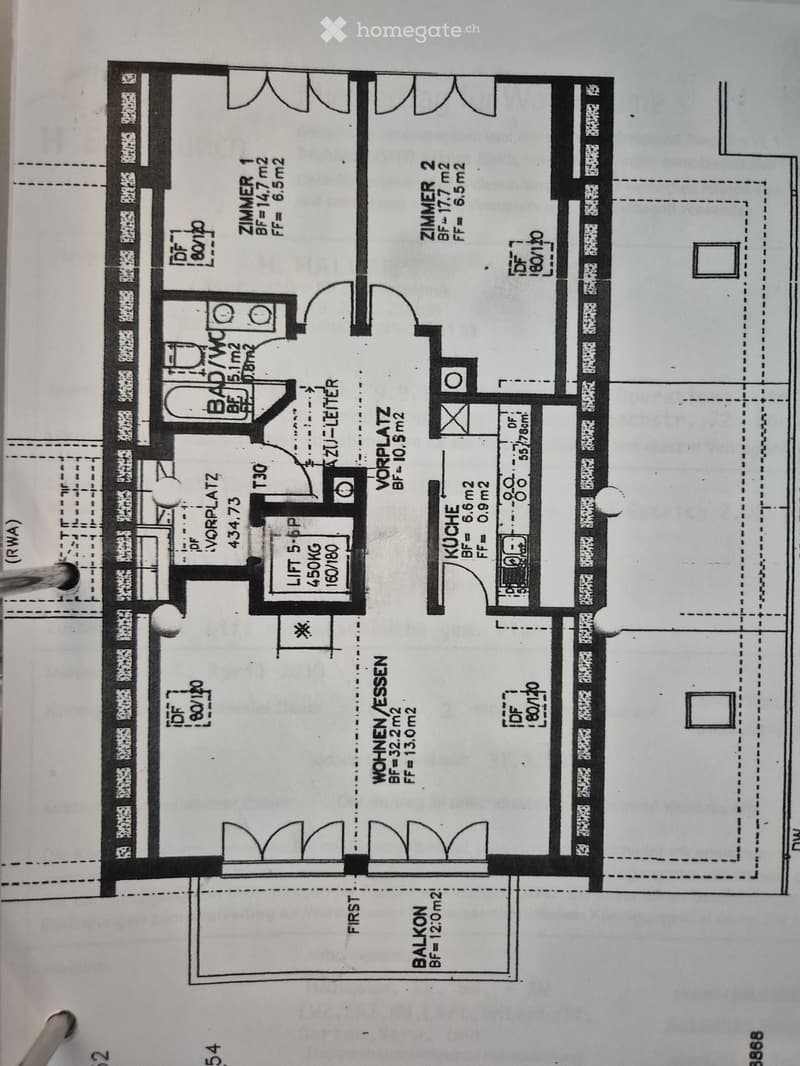 Floor plan showing a first-floor layout with a living area, kitchen, two bedrooms, bathroom, and balcony.