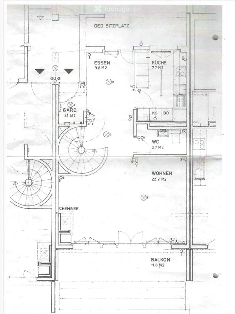 Floor plan showing a living area, dining area, kitchen, bedroom, bathroom, balcony, and a garden area.