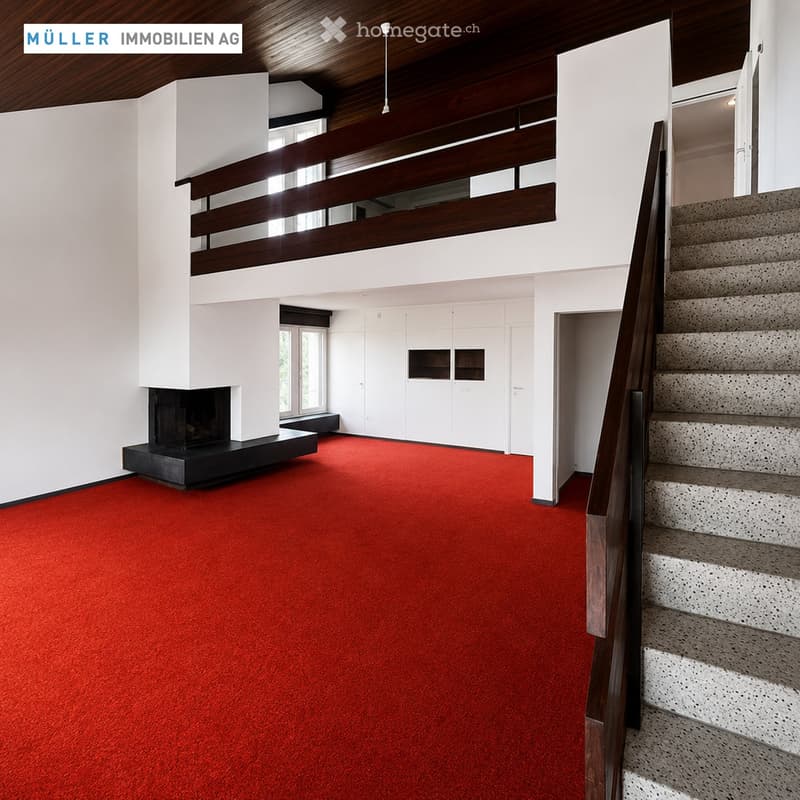 Modern hallway with red carpeting, a staircase leading upwards, and a fireplace on the left side.