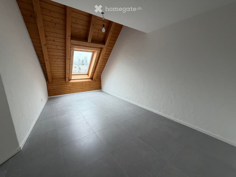 empty room with wooden ceiling, square tiled floor, small window