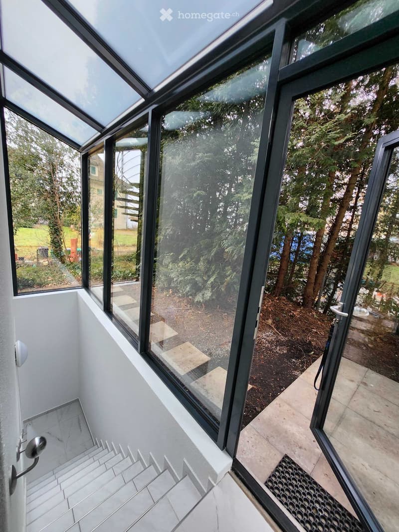 glass doors, tiled floor, balcony, staircase, glass windows, plants, green grass
