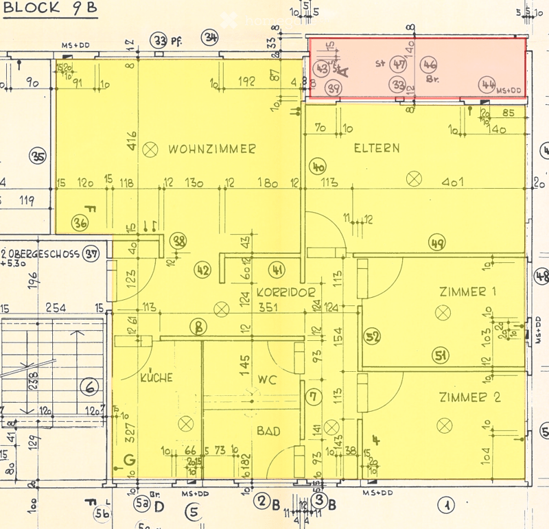 Floor plan of a residential unit labeled "BLOCK 9 B" showing multiple rooms including living room, kitchen, bathroom, bedrooms, and corridor.