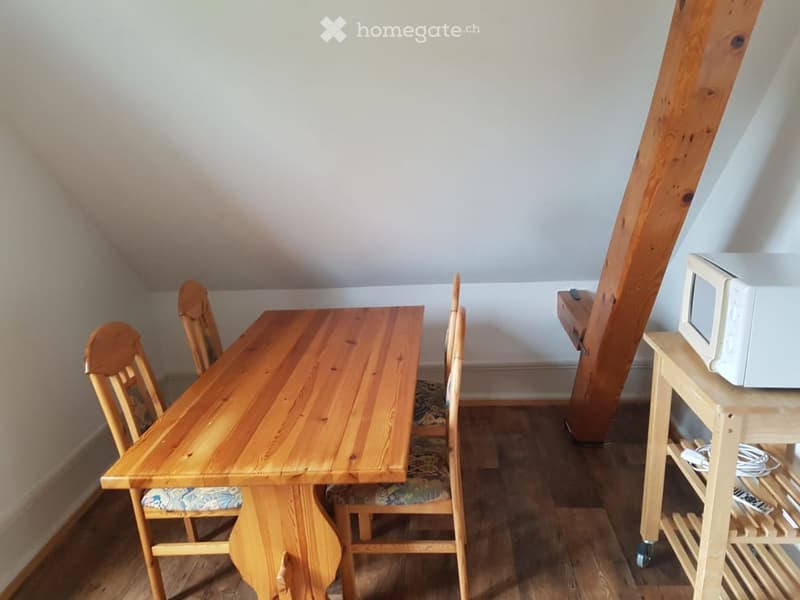 Wooden table, 4 wooden chairs, microwave on a small table