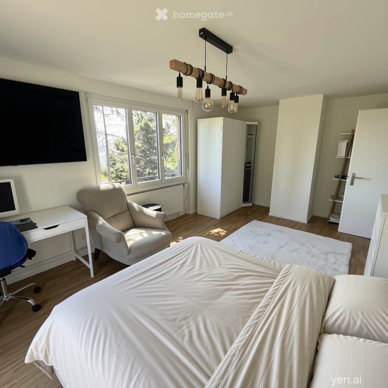 Bright bedroom with wooden flooring, large window, bed, armchair, desk, wardrobe, and modern lighting fixture.