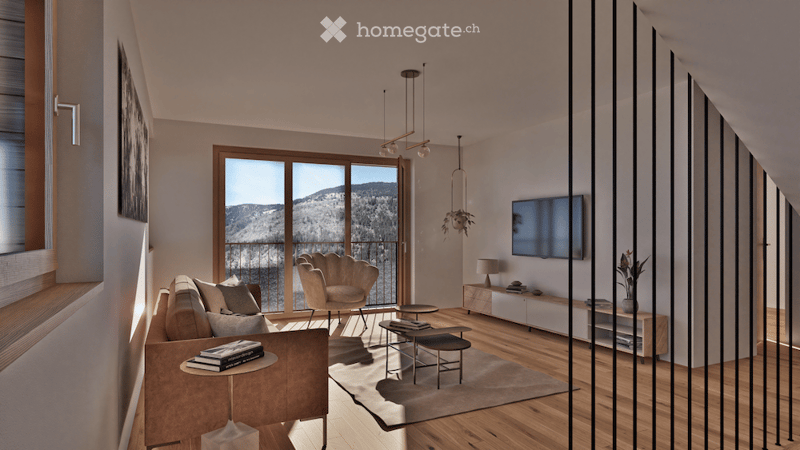 Modern living room with large windows offering a scenic mountain view, featuring a grey sofa, coffee table, armchair, ottoman, floor lamp, television, and decorative items.