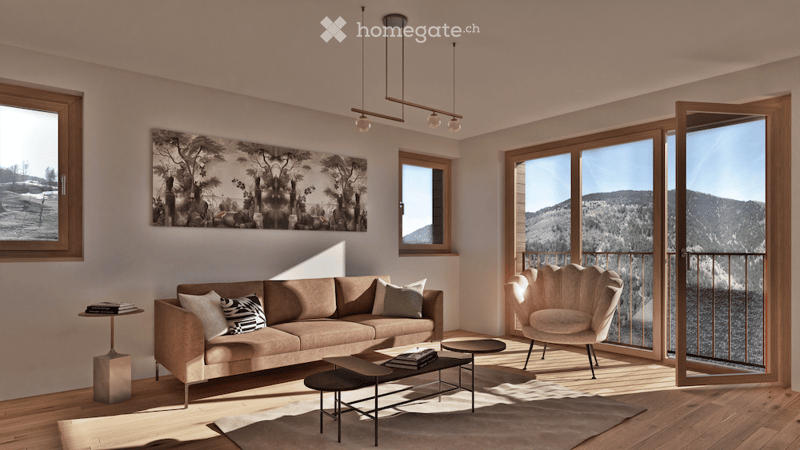 Modern living room with large windows and a view of mountains, featuring a beige sofa, coffee table, side table, and a unique chair. Artwork adorns the wall, and the space is well-lit with natural light.