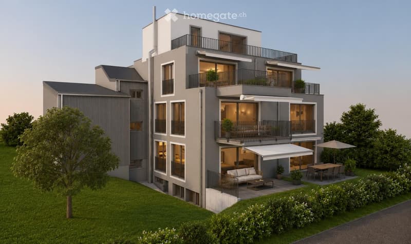 Modern multi-story residential building with balconies, large windows, and a well-maintained garden area with outdoor seating.