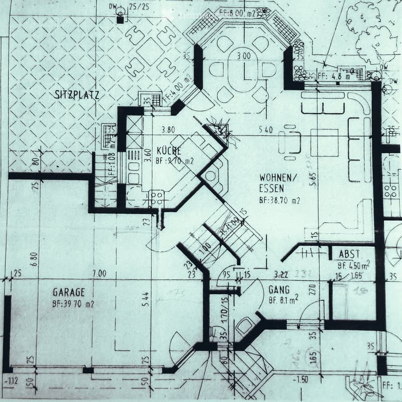 Floor plan showing a garage, kitchen, living/dining area, hallway, and bathroom with labeled dimensions and room names.