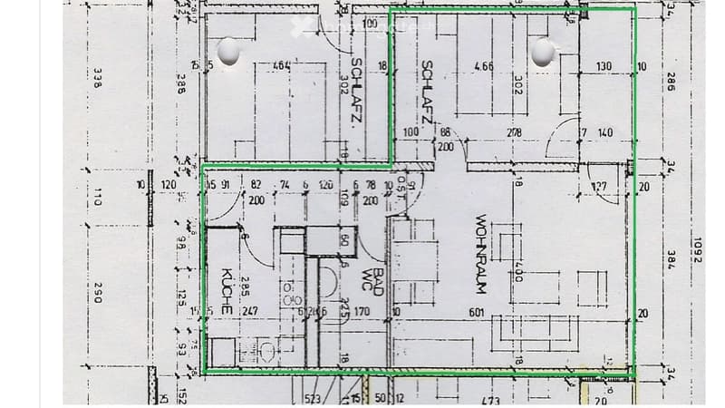 Floor plan showing a multi-room layout including a kitchen, bathroom, living area, and bedroom. Dimensions and room labels are indicated.