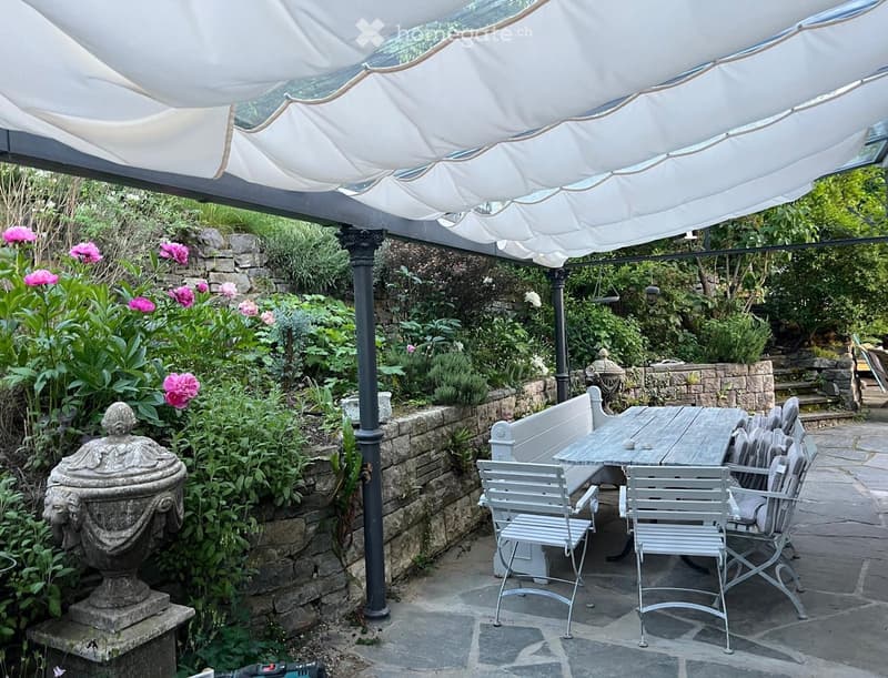 covered terrace, garden furniture, flowers, stone wall, outdoor dining set