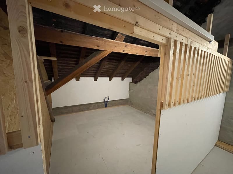 empty room, wooden beams, unfinished, concrete floor, white walls