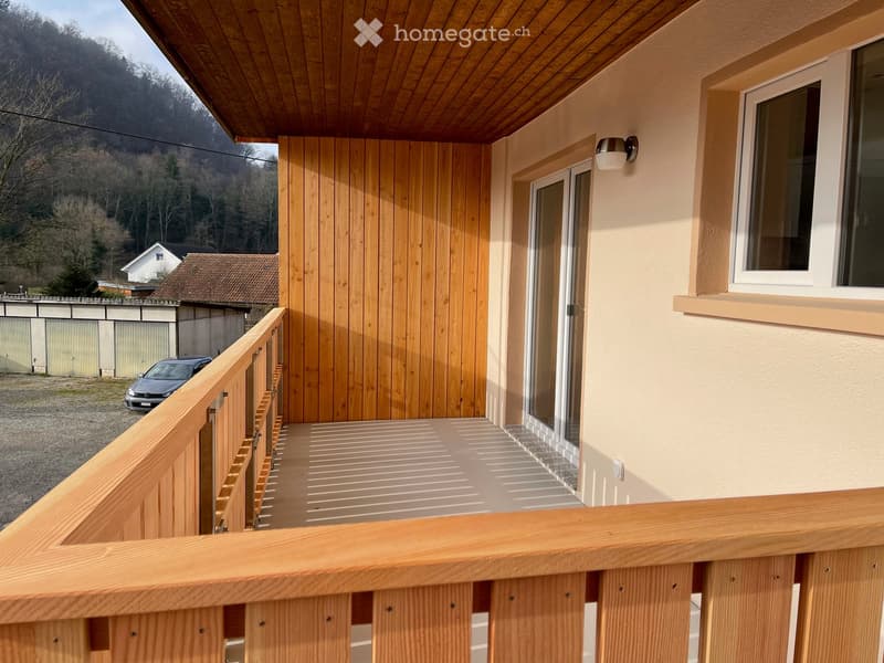 Wooden balcony, wooden railing, outdoor lighting, sliding glass doors, tiled floor