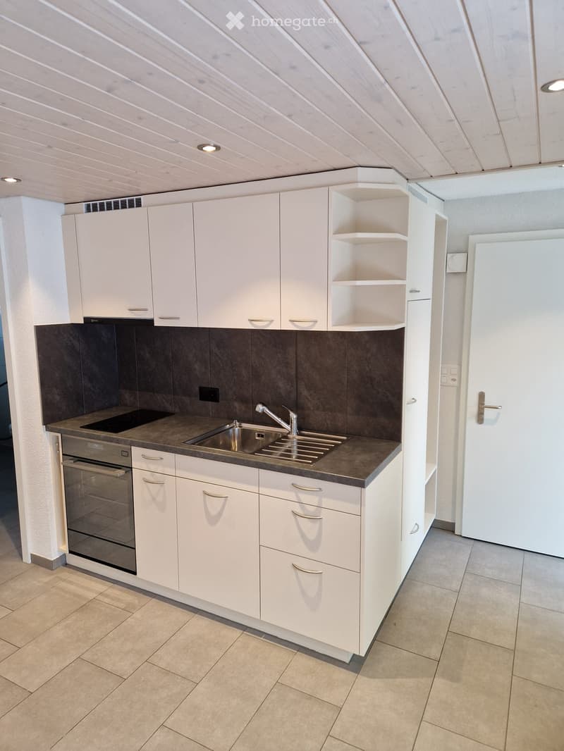 white cabinetry, tiled floor, countertop, sink, oven