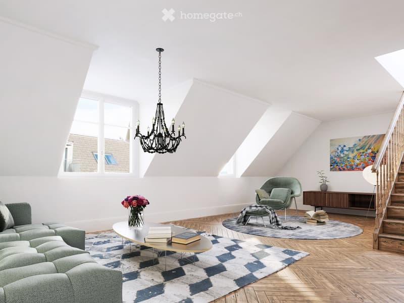 Bright living room with slanted ceilings, large windows, a green sofa, a coffee table with books and a vase of flowers, a green armchair, a sideboard, and a staircase leading upwards.
