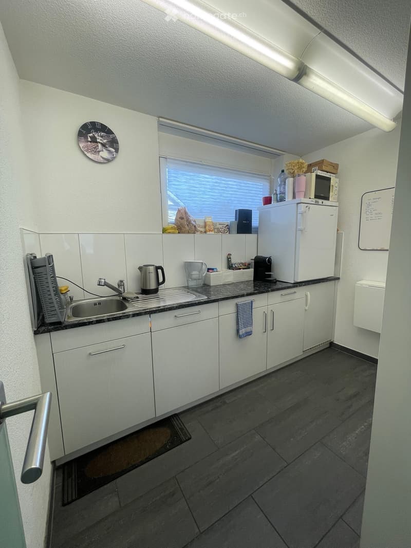 {"type": "Kitchen", "objects": ["sink", "faucet", "refrigerator", "microwave", "coffee maker", "cupboard", "clock", "cup", "bottle", "fridge", "oven", "cupboard", "faucet", "cupboard", "cupboard", "cupboard", "cupboard", "cupboard", "cupboard", "cupboard"