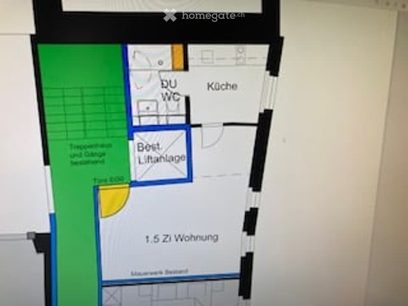 Floor plan of a residential unit showing a living room, kitchen, bedroom, and bathroom.