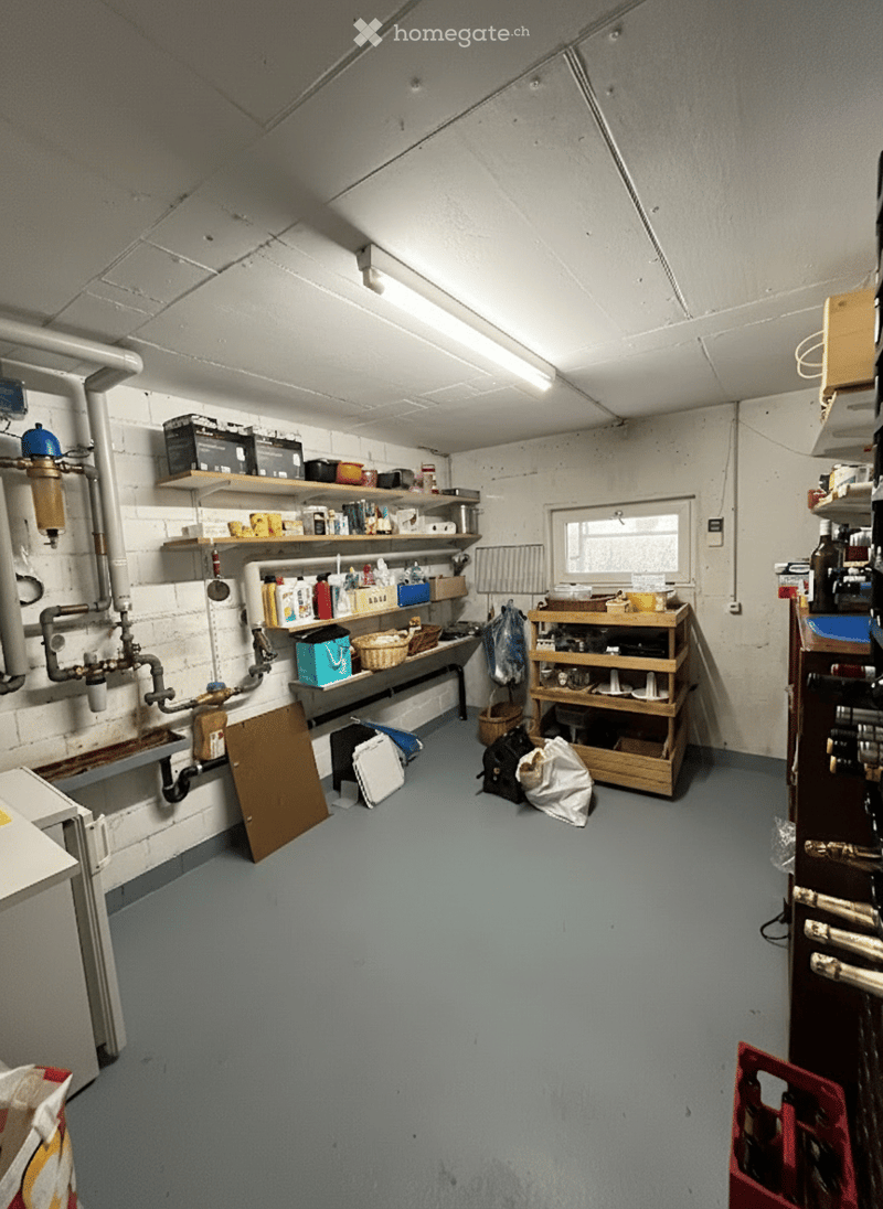 storage room, white brick walls, metal pipe, shelves, bottles, plastic bags, wooden shelves