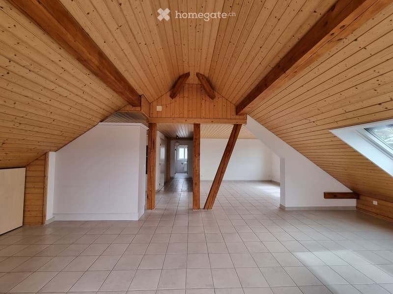 empty attic room, wooden ceiling, wooden beams, white tile flooring, glass window