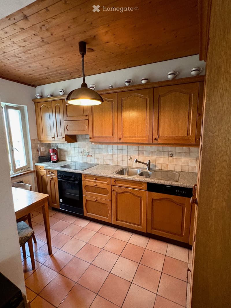 kitchen with wooden cabinets, ceramic tiles, granite countertop, stainless steel sink, dishwasher, electric range