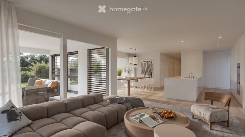 Open-plan living and dining area with modern furniture, large windows, and a kitchen island.
