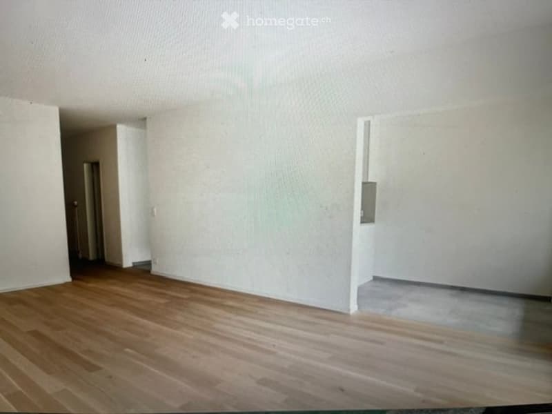 Completely empty room with bare walls and wooden floor. No furniture or equipment.