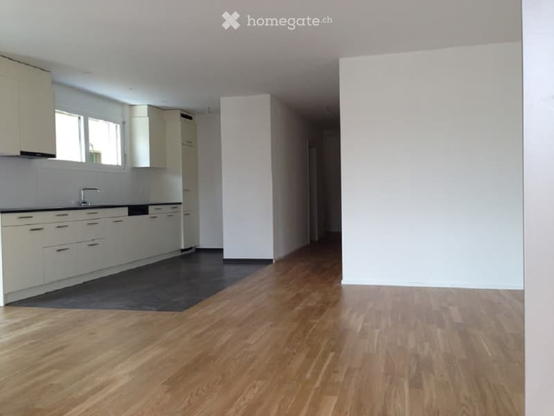 Completely empty room with bare walls and wooden floor. No furniture or equipment.