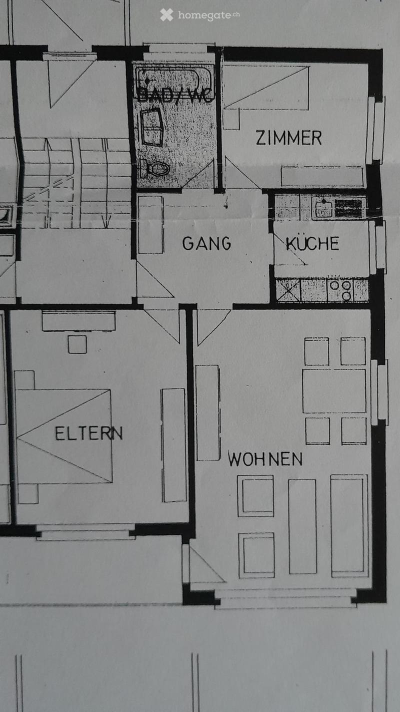 Floor plan showing a bathroom, hallway, kitchen, living area, and bedroom.