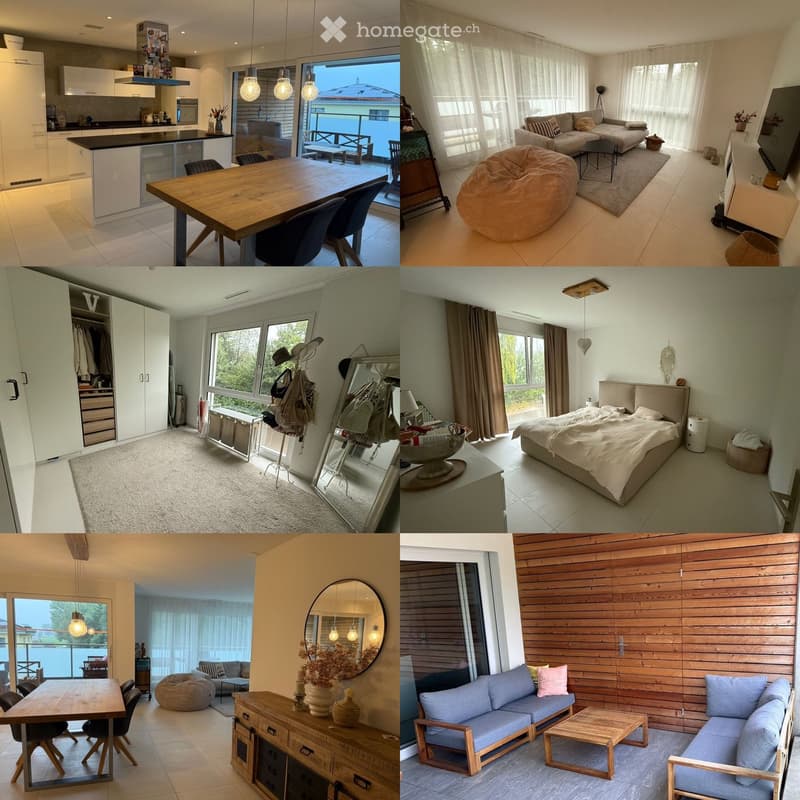 A modern, well-furnished house with multiple rooms including a kitchen, living room, bedroom, and balcony. The kitchen features white cabinets, a black countertop, and a dining table. The living room has a sofa, bean bag chair, coffee table, and large win